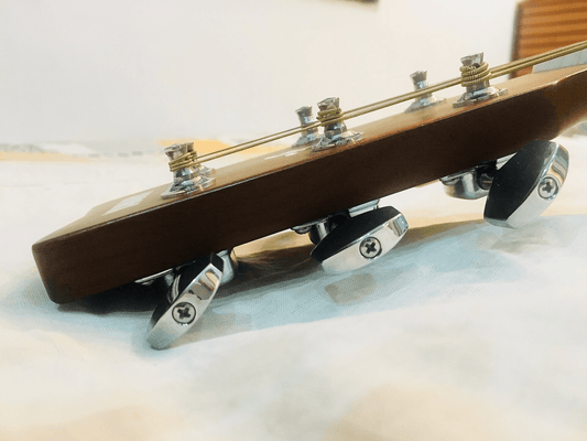 How to Change Guitar Strings Without Damaging the Neck - Musiciangoods