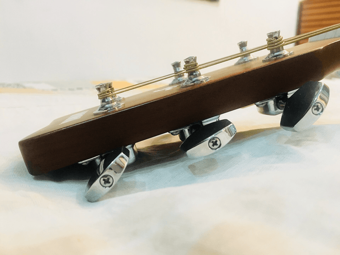 How to Change Guitar Strings Without Damaging the Neck